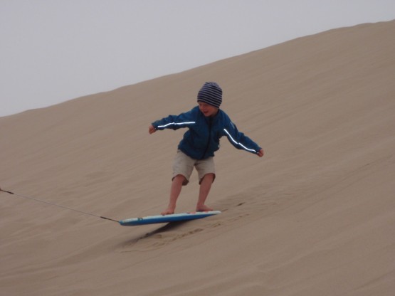getting ready for real surf: Robinson riding the Florence sand dunes 