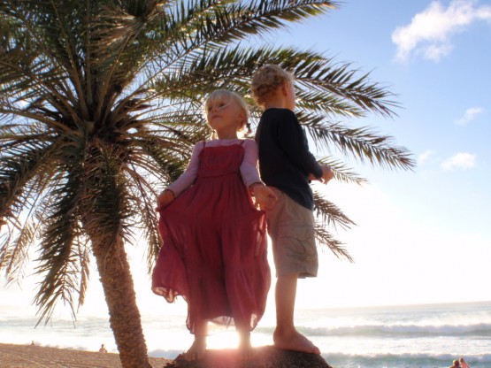 Sienna and Robinson surfing at North Shore ...on a rock...