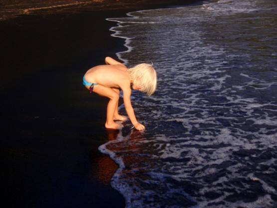 SIENNA in the warm black sand