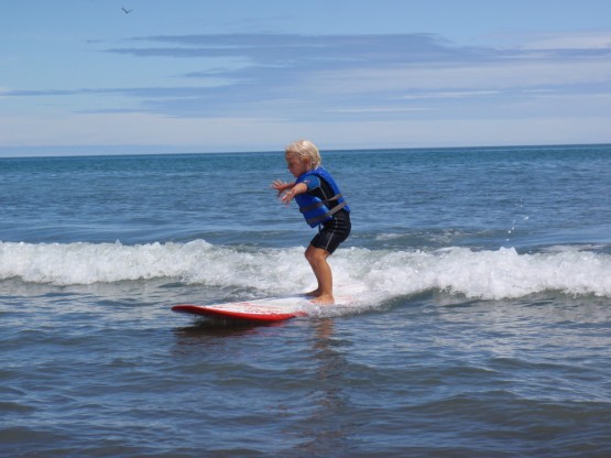 Sienna enjoying a ride on a llooooongboard