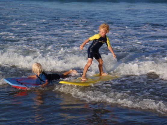 surfing Robinson and Sienna playing in the waves...