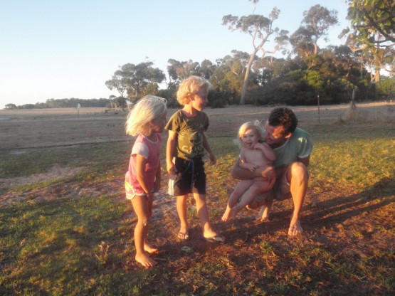 farmkidsben getting fresh figues from the tree